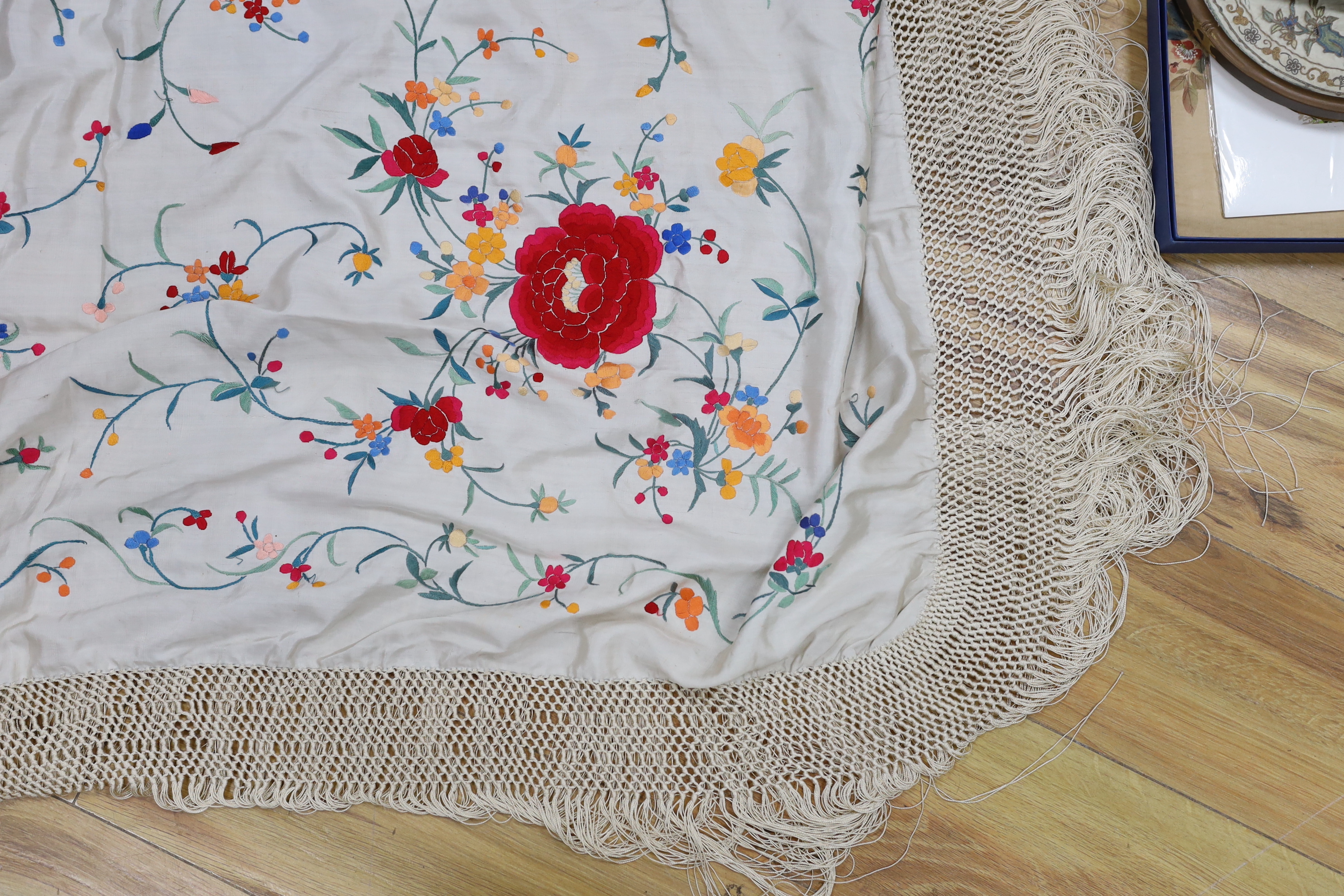 A Chinese cream silk polychrome embroidered shawl